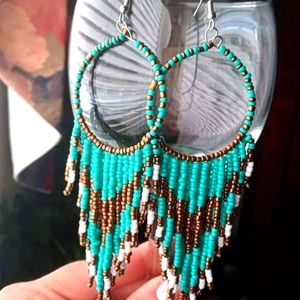 Handmade earrings with Shakira's different colors.